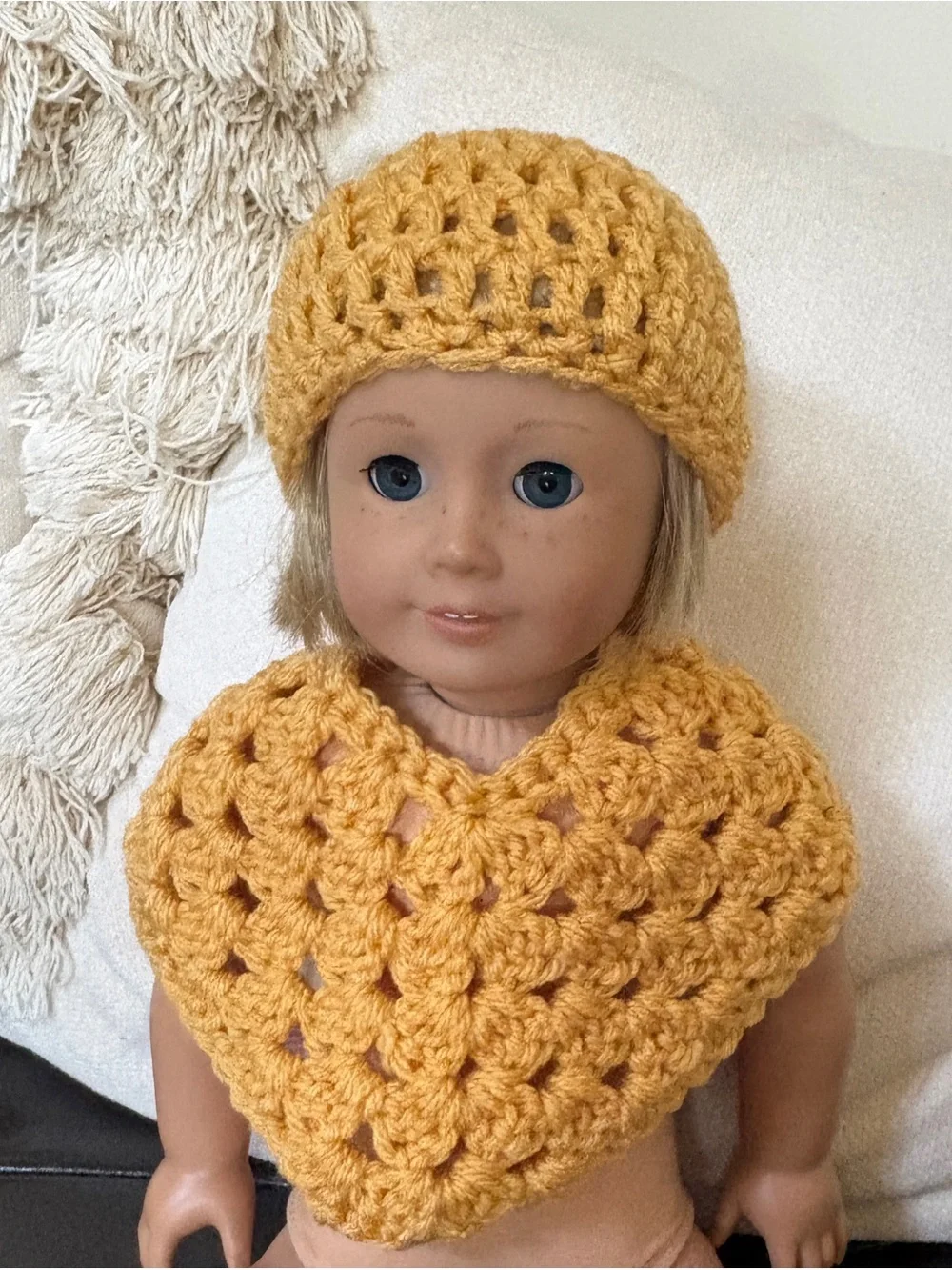 Yellow handmade crochet doll hat and poncho set
